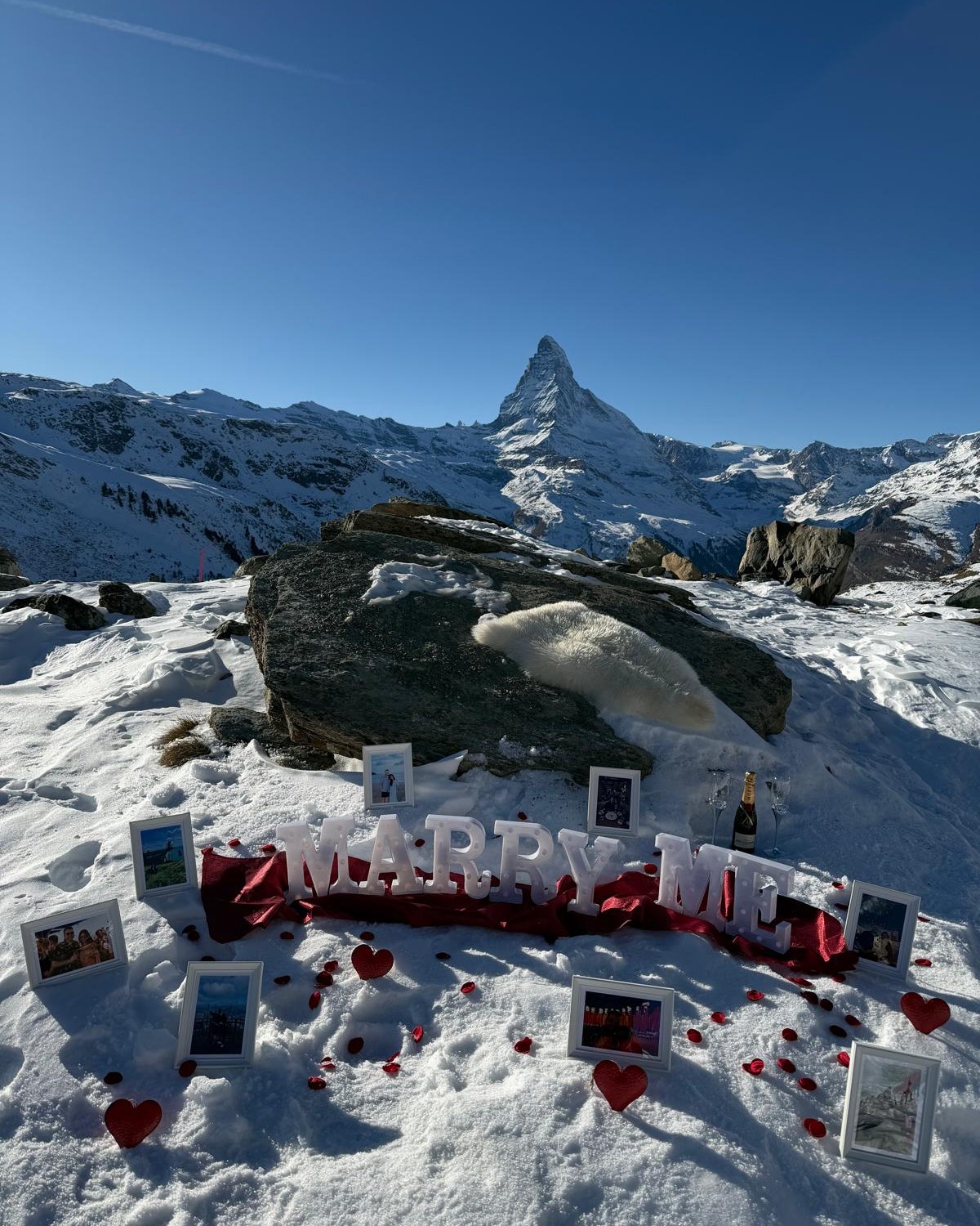 Marriage proposal setup in the snow beneath the Matterhorn in Zermatt